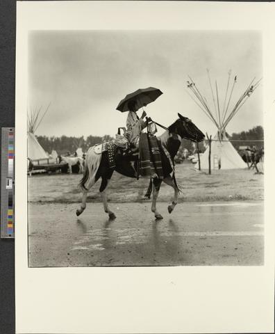 Crow Woman on Horse with Umbrella, Crow Fair, Crow Agency, Montana (recto)