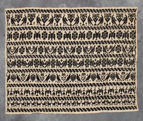Wall Hanging of black and white cotton in horizontal bands with figures, birds and plant motifs