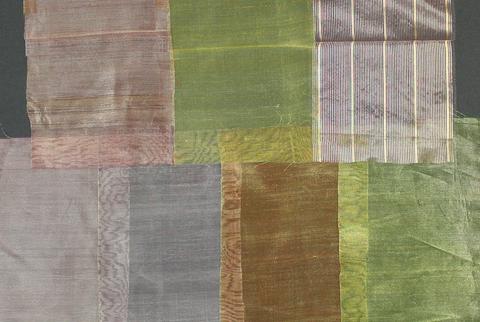 Textile samples of metallic gold and colored silk organdy - plain weave in various pale colors are sheer and shimmery