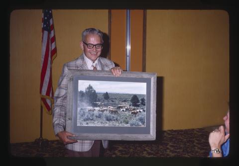 Wilbur Cooney receiving photograph of Reub Long's horses, Hood River, Oregon, 1979
