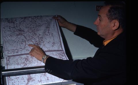 Earl Bates with a weather chart