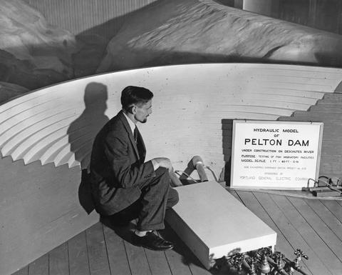 OSC Professor Roy Shoemaker with scale model of Pelton Dam