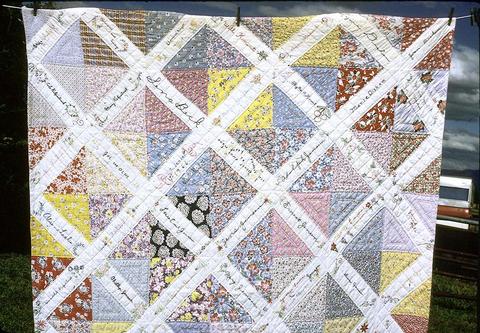 65 x 85 inch started by Emma Jensen's daughter in Can.(?). Sent squares to family and friends, got pieces back for Emma Jensen's birthday in 1939 but never got around to quilt it. Hattie and Marguerite quilted it about 1955. (Don't know why 1966 is on it.) Junction City