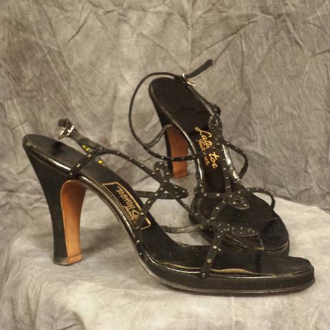 Sandals of black suede accented with tiny cabochons